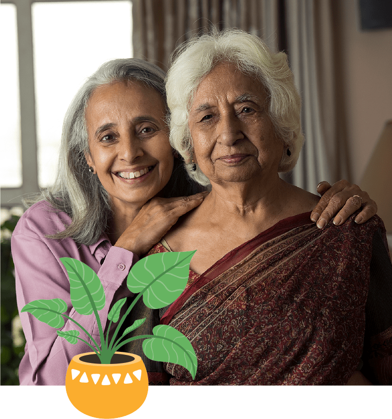 a smiling older woman with her hands on another smiling older woman's shoulders with a plant illustration
